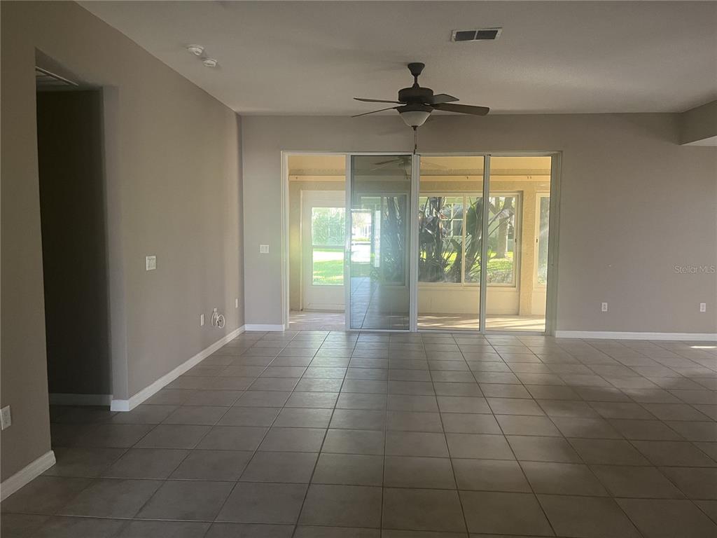 26601 Bull Run Leesburg, FL 34748 - Photo 3 of 15 a view of an empty room with glass door