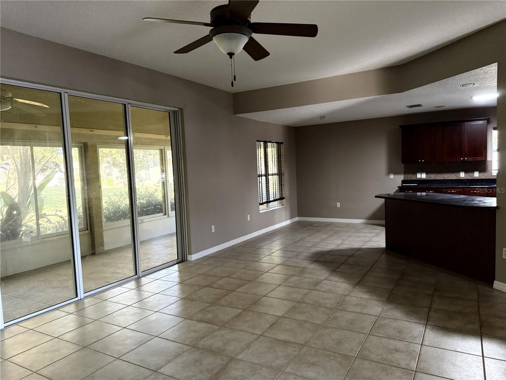 26601 Bull Run Leesburg, FL 34748 - Photo 4 of 15 a view of a livingroom with furniture and a flat screen tv