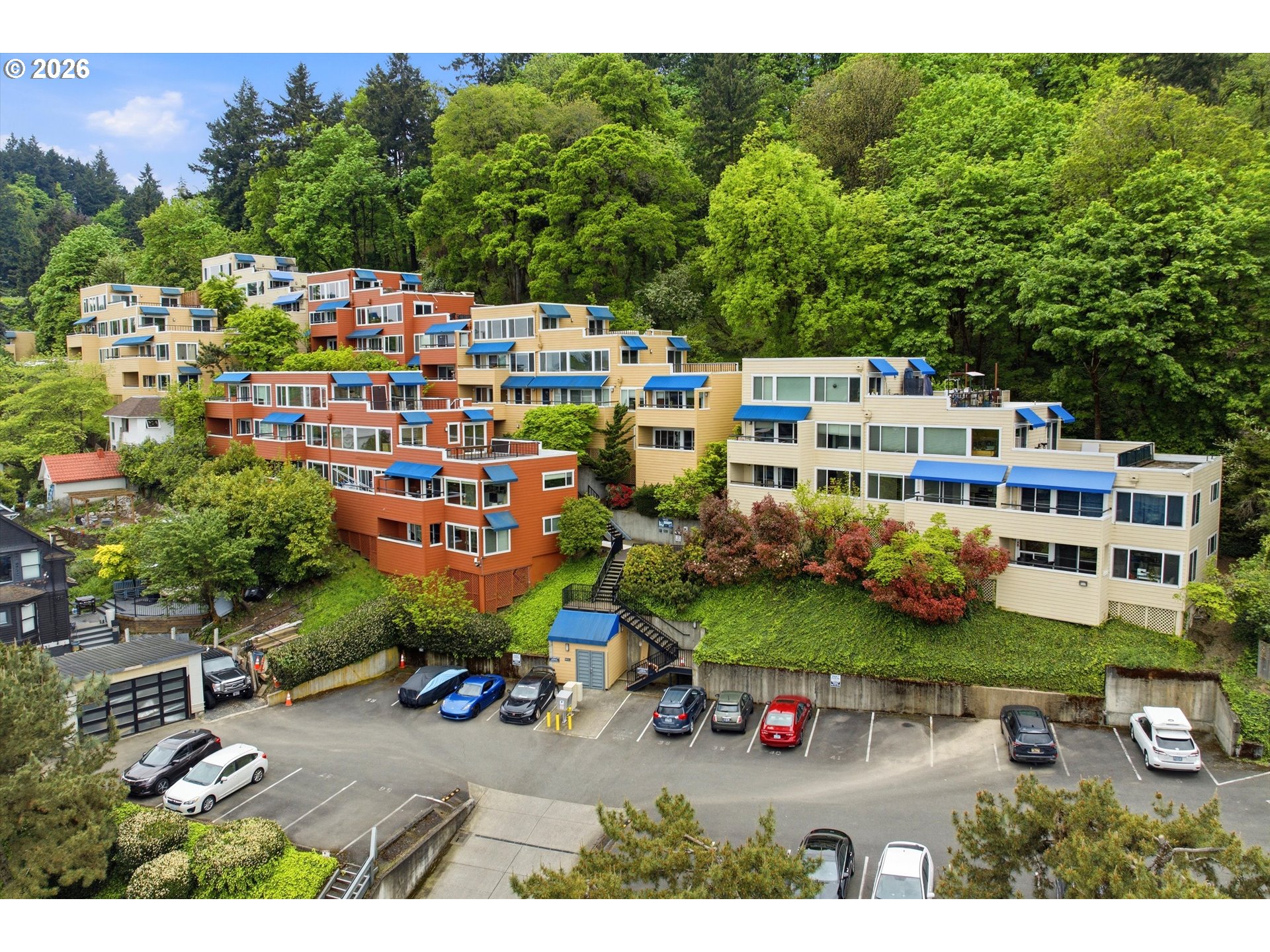 3515 Southwest Barbur Boulevard, Unit X3 Portland, OR 97239 - Photo 1 of 33 an aerial view of a house with a garden and outdoor seating