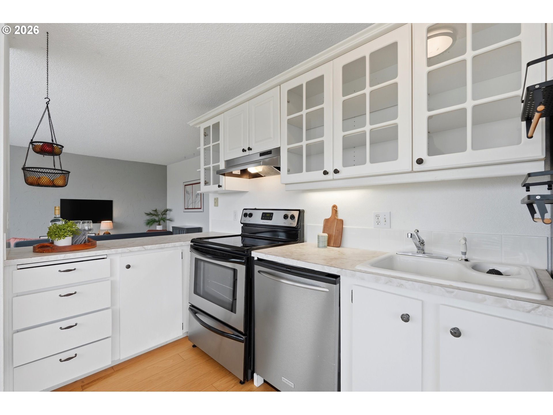 3515 Southwest Barbur Boulevard, Unit X3 Portland, OR 97239 - Photo 16 of 33 a kitchen with a sink and cabinets