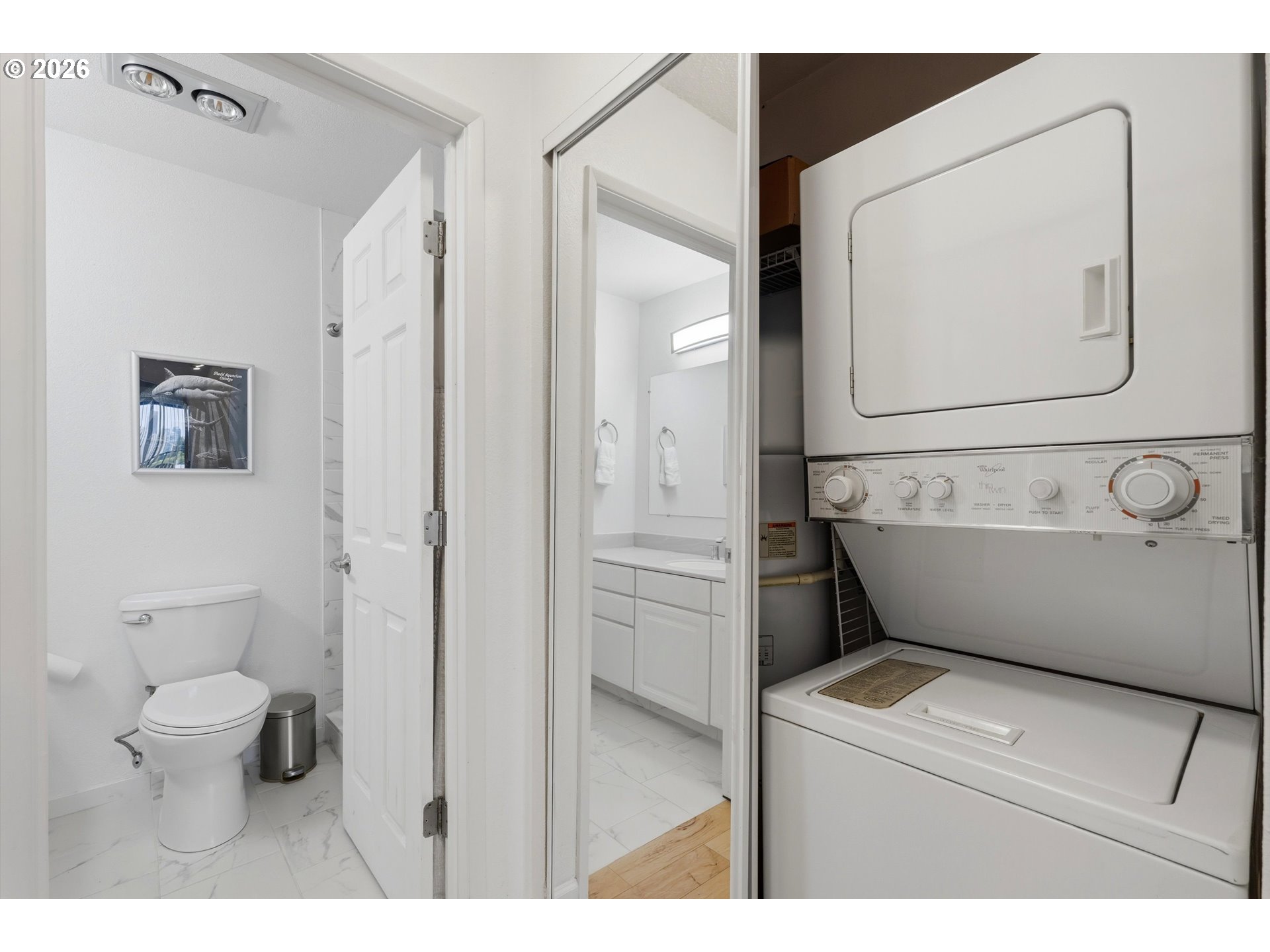 3515 Southwest Barbur Boulevard, Unit X3 Portland, OR 97239 - Photo 20 of 33 a bathroom with a toilet sink and mirror