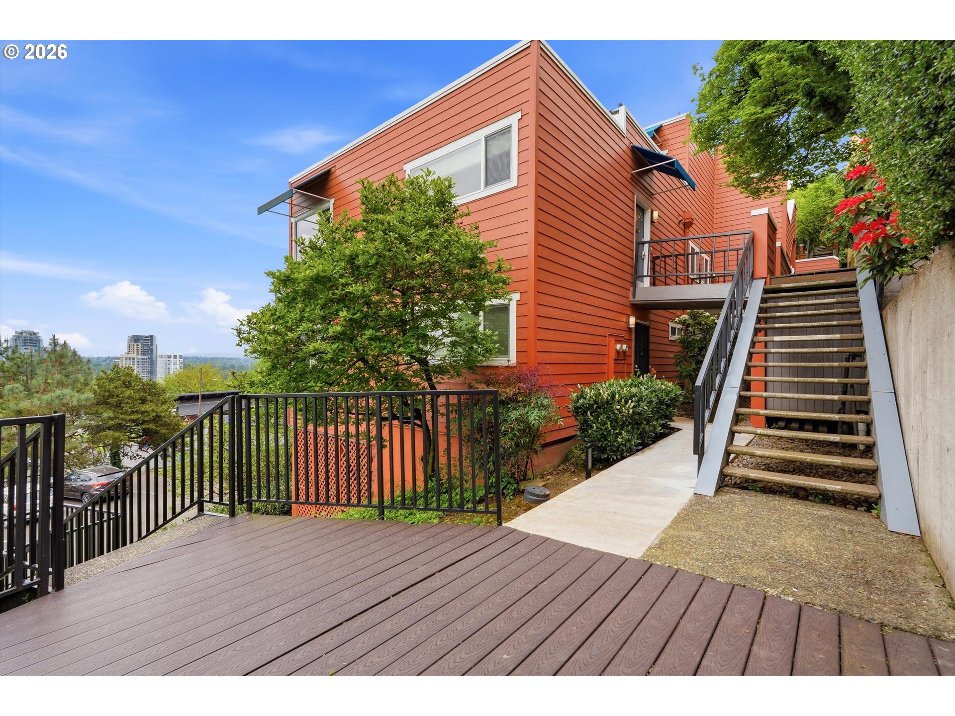 3515 Southwest Barbur Boulevard, Unit X3 Portland, OR 97239 - Photo 24 of 33 a view of a wooden deck and a yard