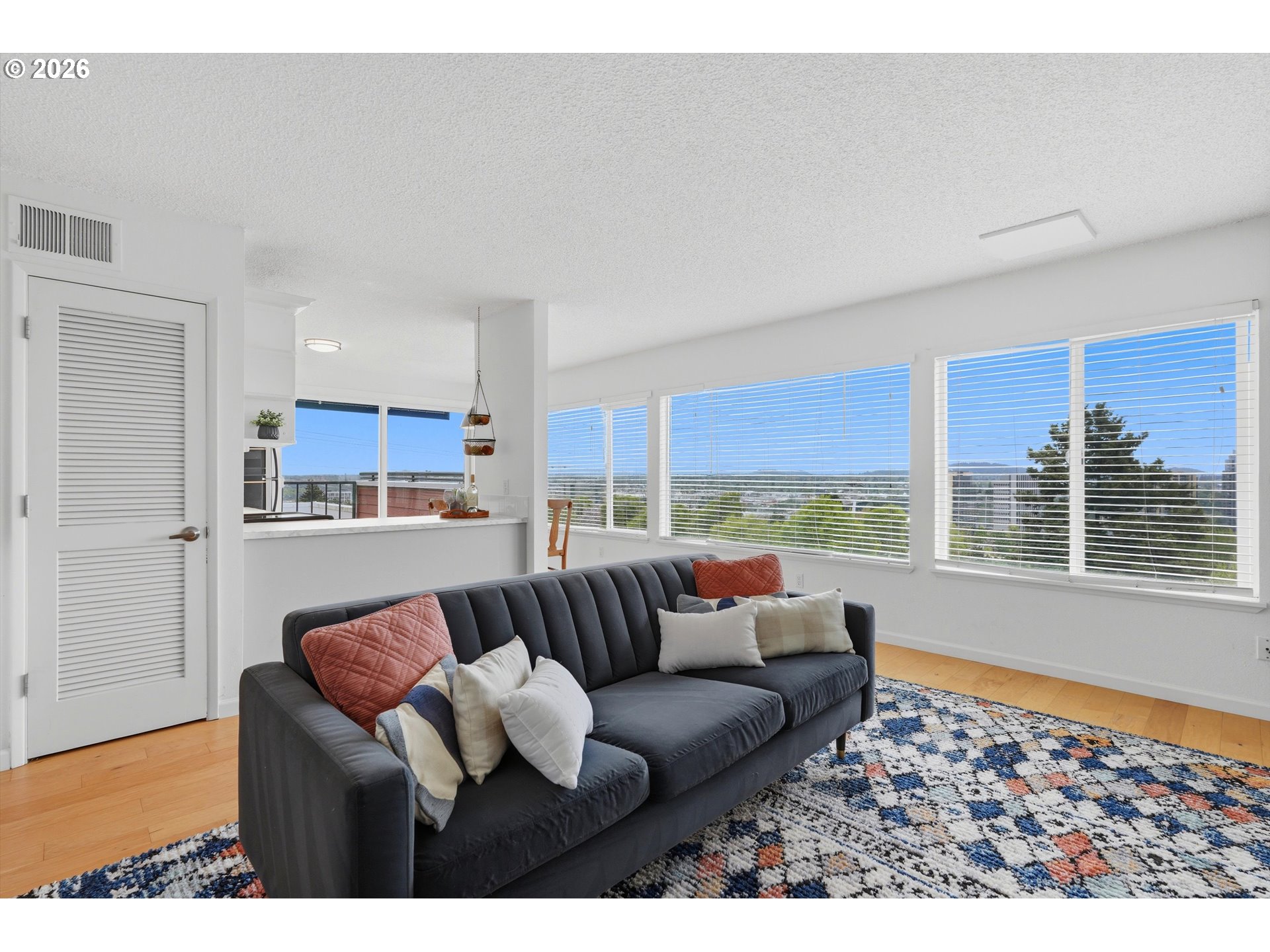 3515 Southwest Barbur Boulevard, Unit X3 Portland, OR 97239 - Photo 3 of 33 a living room with furniture and a large window