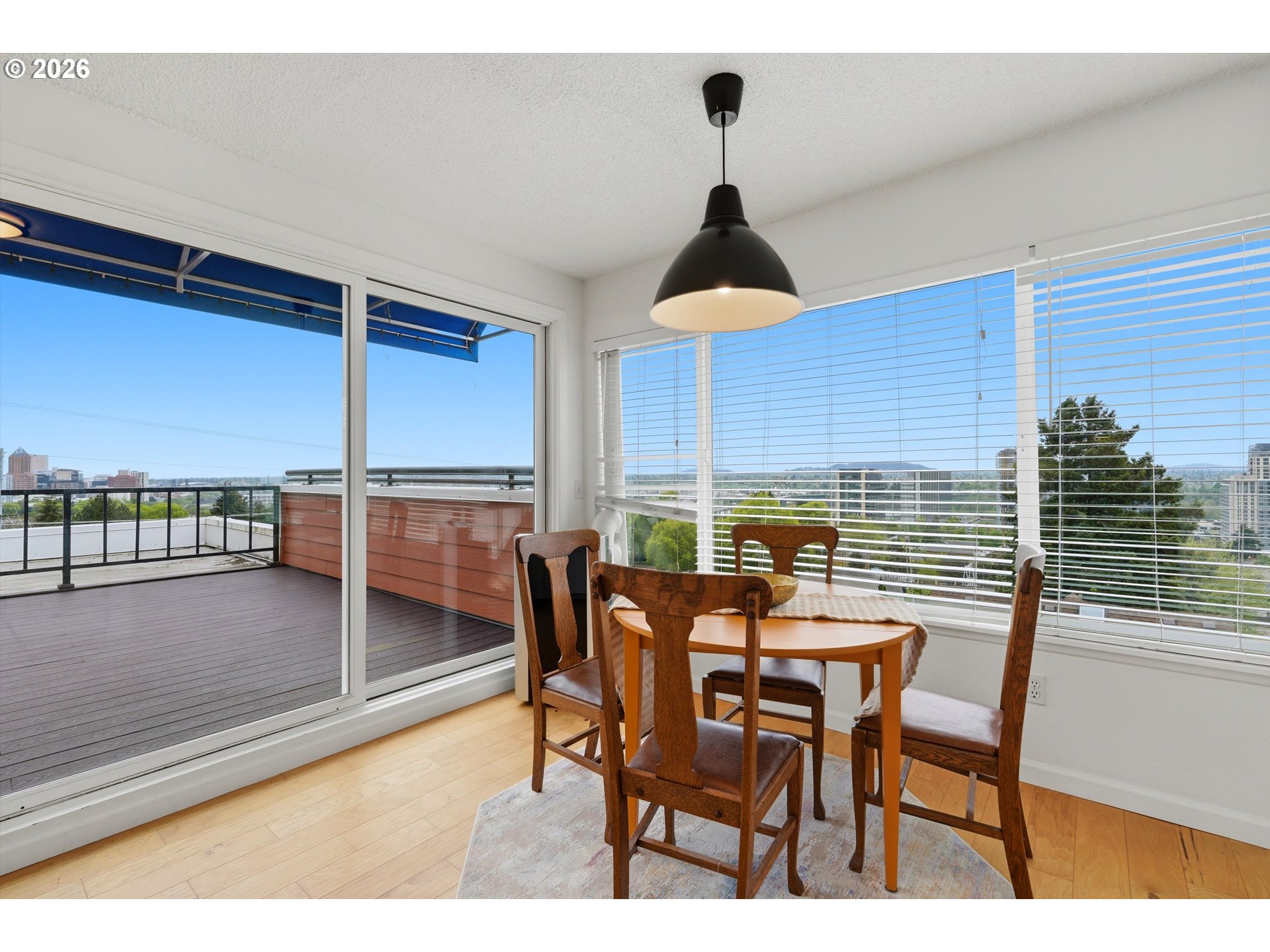 3515 Southwest Barbur Boulevard, Unit X3 Portland, OR 97239 - Photo 5 of 33 a dining room with furniture and window