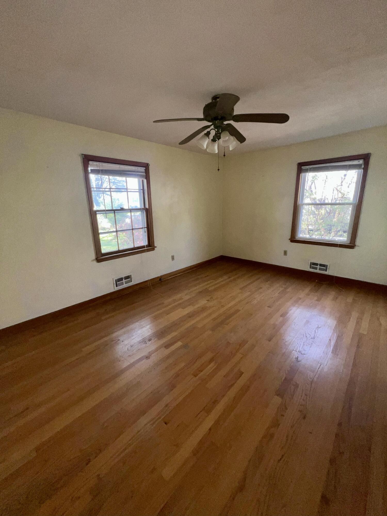 984 Colbourne Avenue Vinton, VA 24179 - Photo 15 of 22 a view of empty room with wooden floor and fan