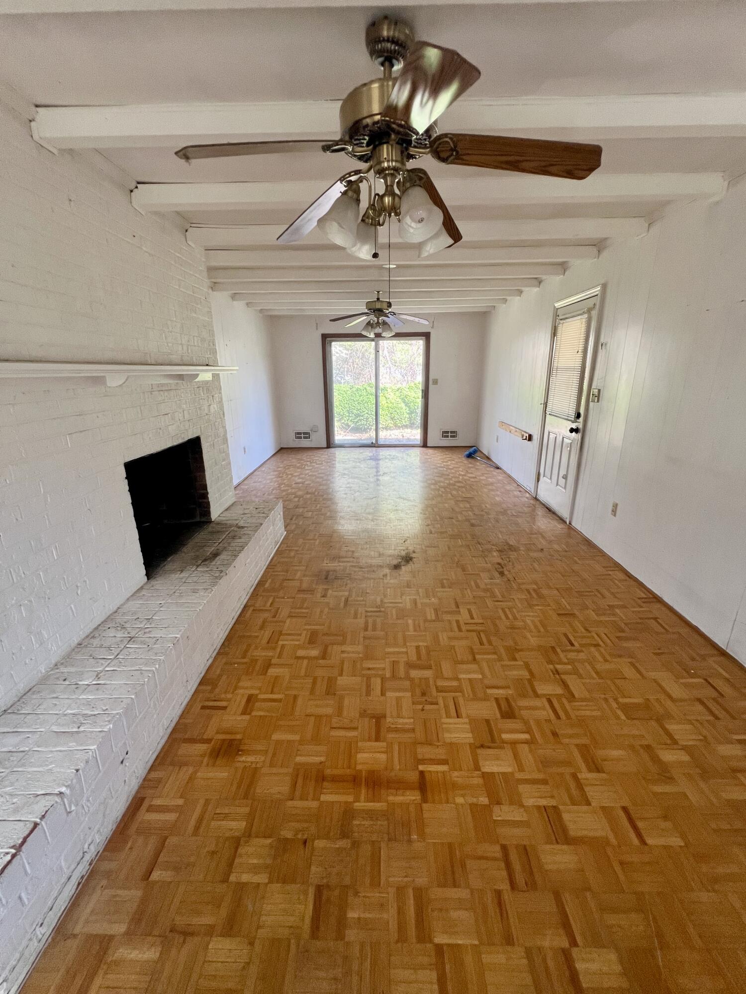 984 Colbourne Avenue Vinton, VA 24179 - Photo 6 of 22 a view of empty room with a fireplace and windows