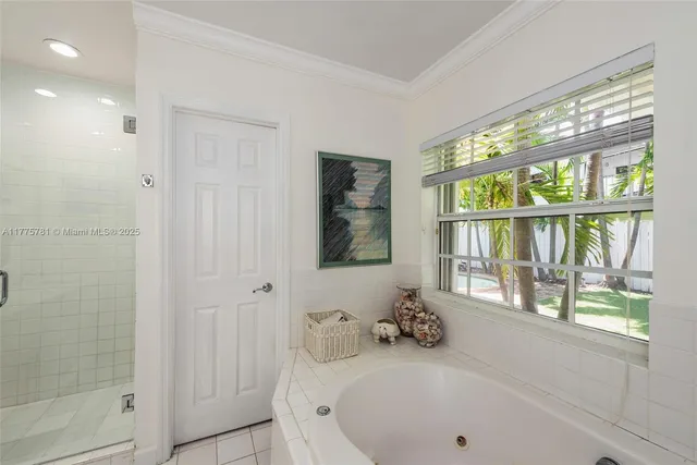 a bathroom with a tub and a window