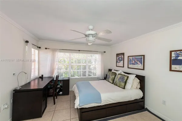 a bedroom with a bed and a table