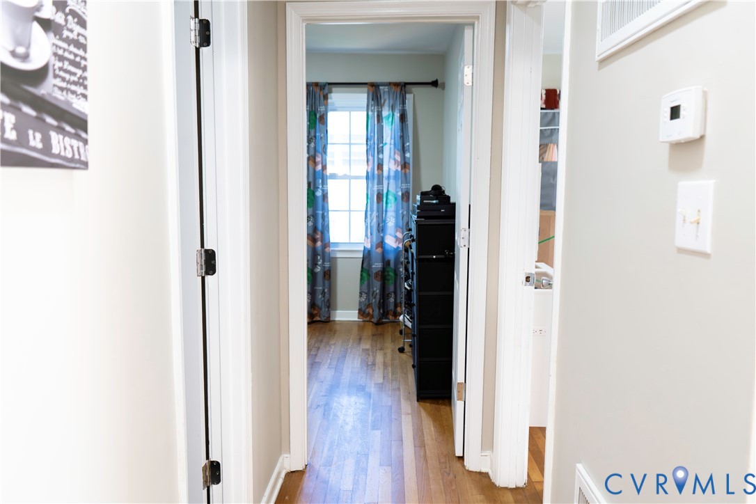 2718 Stacie Road Richmond, VA 23224 - Photo 20 of 50 Hallway featuring light-colored walls and wood-fin