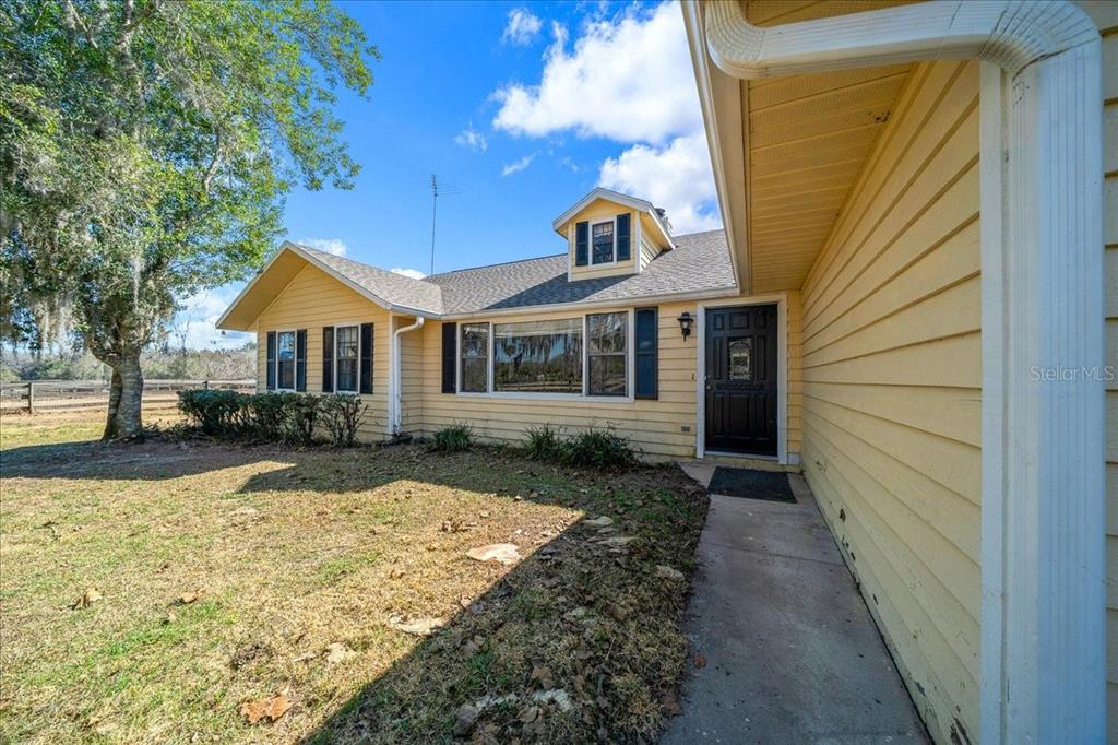 750 Southwest 91st Place Ocala, FL 34476 - Photo 11 of 51 a front view of a house with a yard
