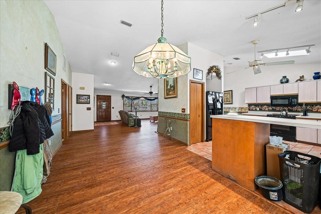 750 Southwest 91st Place Ocala, FL 34476 - Photo 18 of 51 a kitchen with stainless steel appliances granite countertop a refrigerator a stove oven and a sink with cabinets