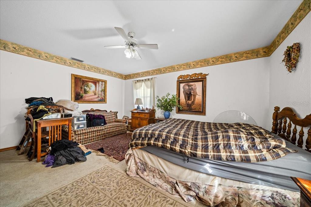 750 Southwest 91st Place Ocala, FL 34476 - Photo 20 of 51 a bedroom with furniture and windows