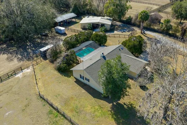an aerial view of residential house with outdoor space