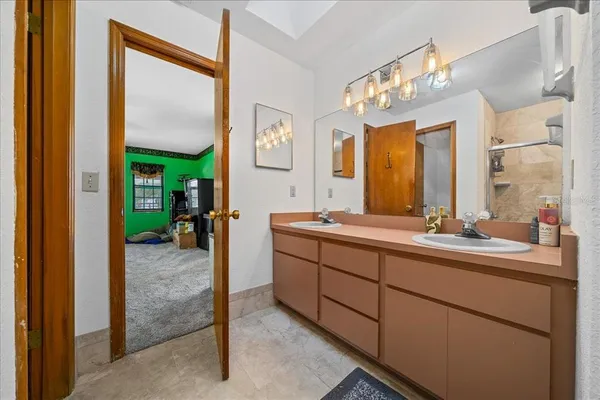 a bathroom with a sink and a mirror