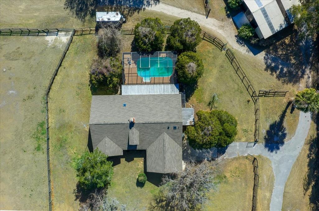 750 Southwest 91st Place Ocala, FL 34476 - Photo 28 of 51 an aerial view of a house with a yard and large trees