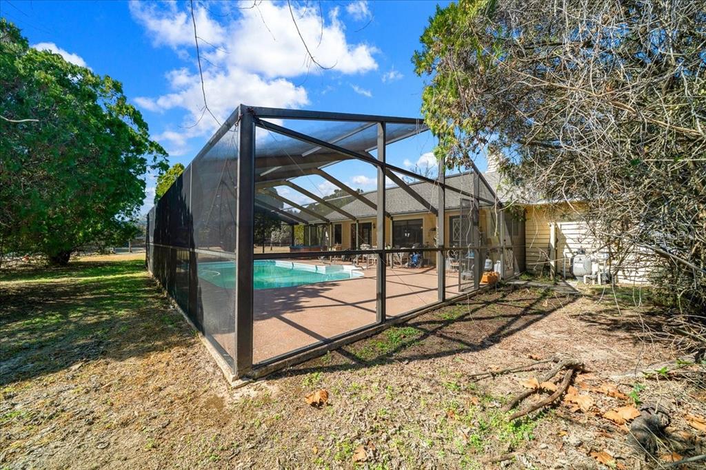 750 Southwest 91st Place Ocala, FL 34476 - Photo 30 of 51 a view of a house with backyard and a tree