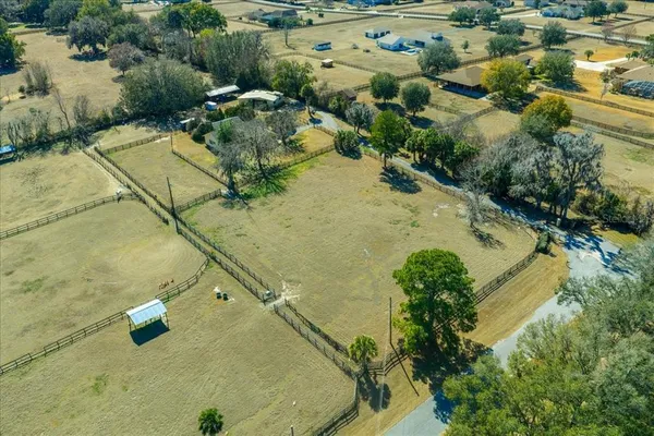 a view of a park with iron fence