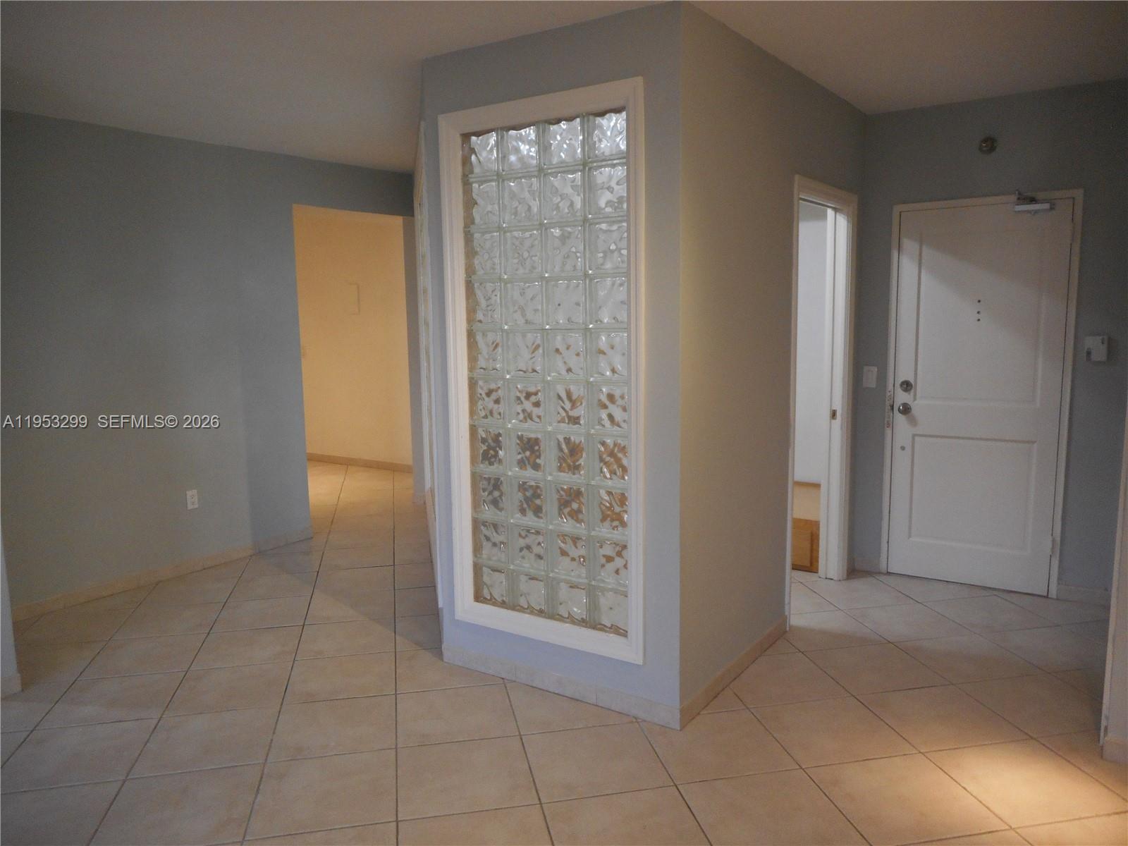 10185 Collins Avenue, Unit 1002 Bal Harbour, FL 33154 - Photo 12 of 27 a view of an empty room with bathroom and window