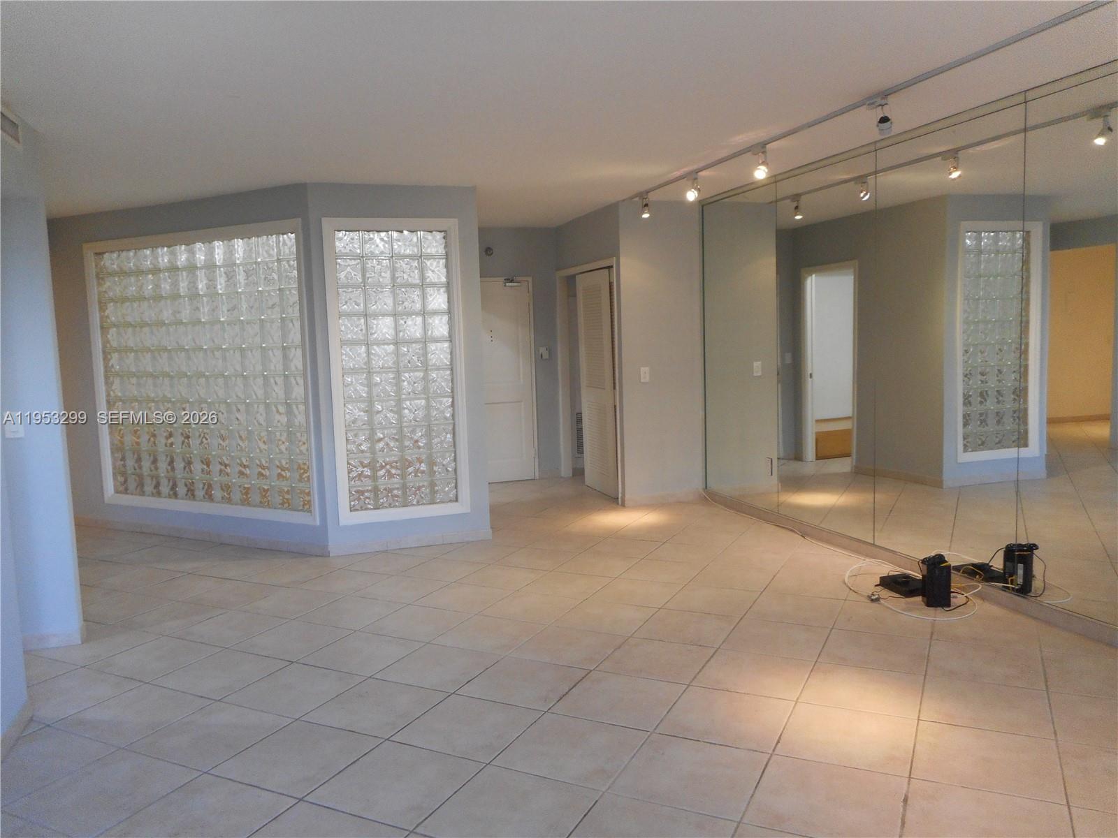 10185 Collins Avenue, Unit 1002 Bal Harbour, FL 33154 - Photo 13 of 27 a view of an empty room with a window