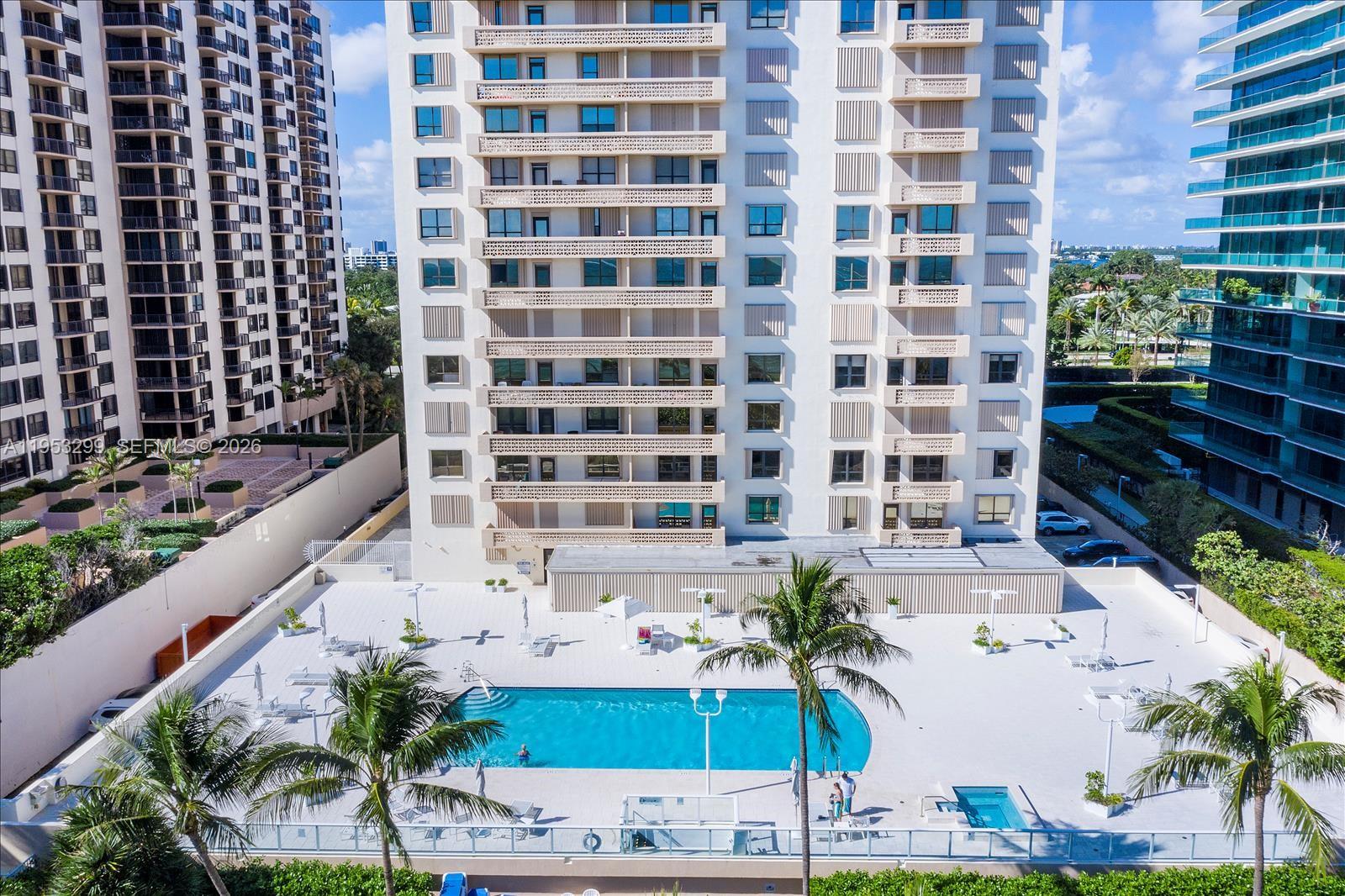 10185 Collins Avenue, Unit 1002 Bal Harbour, FL 33154 - Photo 22 of 27 a view of building with yard and staircase