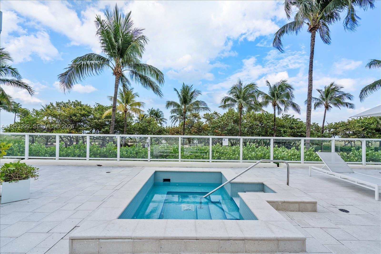10185 Collins Avenue, Unit 1002 Bal Harbour, FL 33154 - Photo 25 of 27 a view of a backyard with palm trees