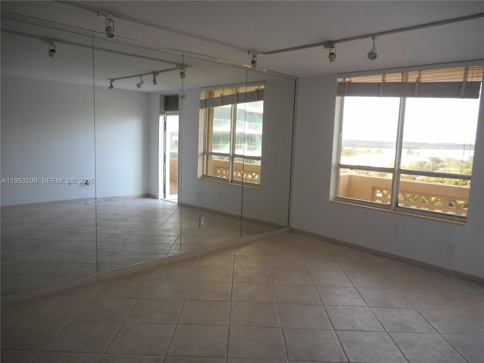 10185 Collins Avenue, Unit 1002 Bal Harbour, FL 33154 - Photo 8 of 27 a view of an empty room with a window