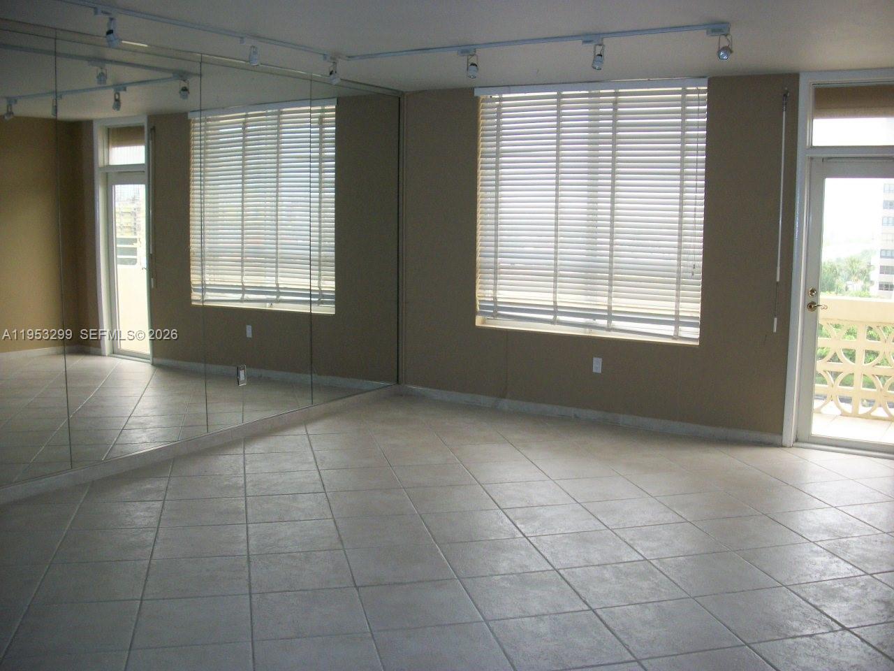10185 Collins Avenue, Unit 1002 Bal Harbour, FL 33154 - Photo 9 of 27 a view of an empty room with a window