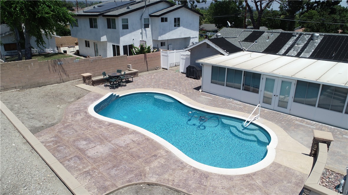 7262 Beryl Street Rancho Cucamonga, CA 91701 - Photo 12 of 30 a view of a house with swimming pool