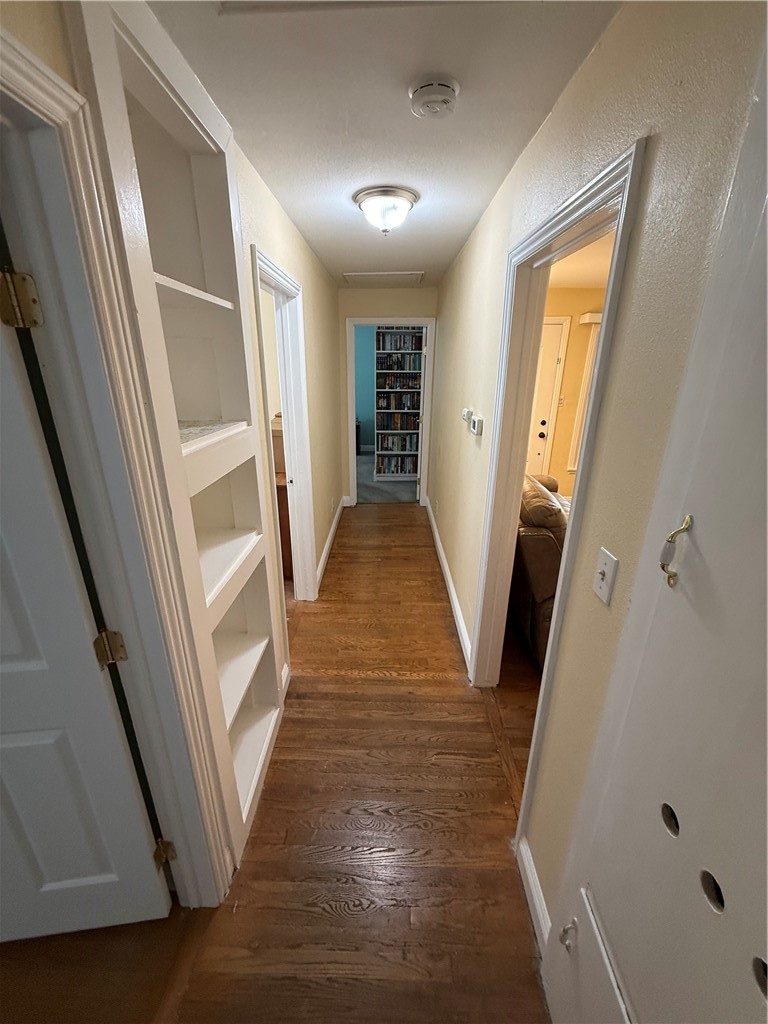 7262 Beryl Street Rancho Cucamonga, CA 91701 - Photo 16 of 30 a view of hallway with stairs and wooden floor