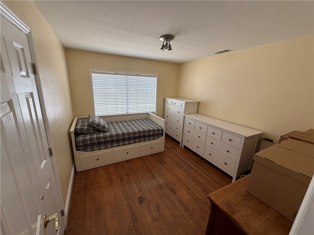 7262 Beryl Street Rancho Cucamonga, CA 91701 - Photo 18 of 30 a room with a bed and wooden floor