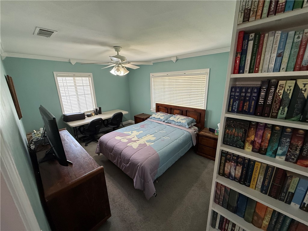7262 Beryl Street Rancho Cucamonga, CA 91701 - Photo 19 of 30 a bedroom with a bed a book shelf and a window