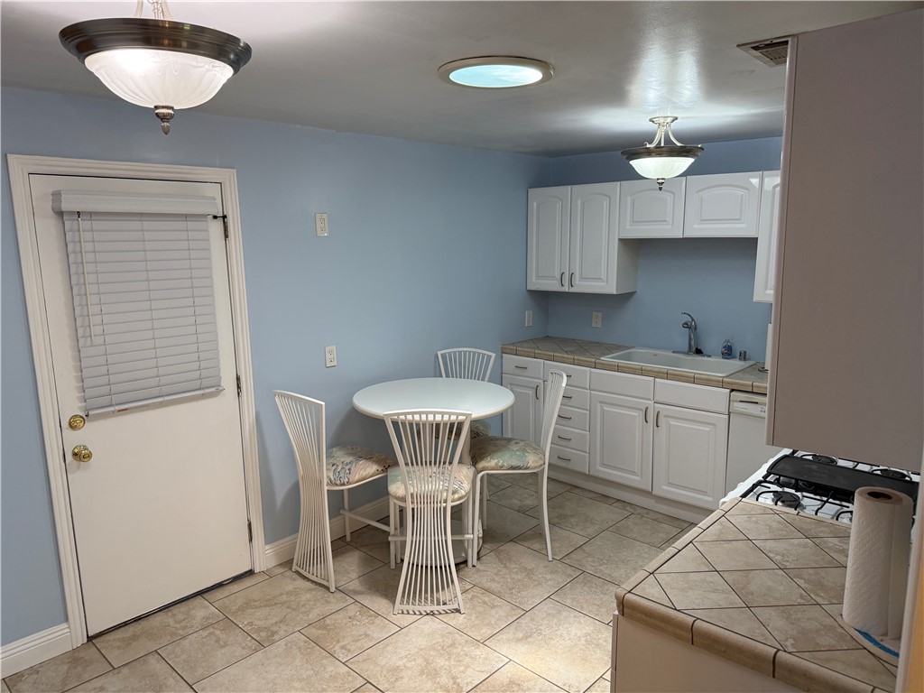 7262 Beryl Street Rancho Cucamonga, CA 91701 - Photo 21 of 30 a kitchen with a table and chairs in it