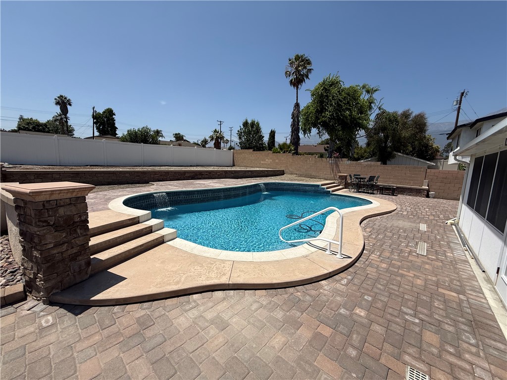 7262 Beryl Street Rancho Cucamonga, CA 91701 - Photo 26 of 30 a view of a swimming pool with outdoor seating and plants
