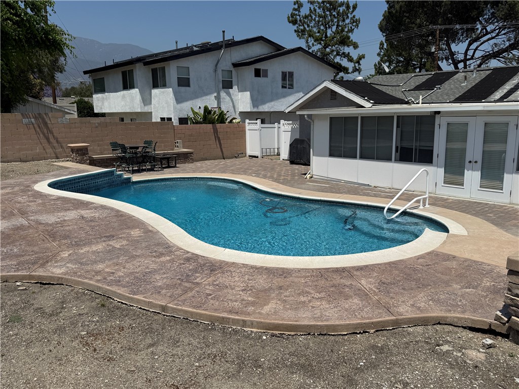 7262 Beryl Street Rancho Cucamonga, CA 91701 - Photo 28 of 30 a view of a house with a swimming pool