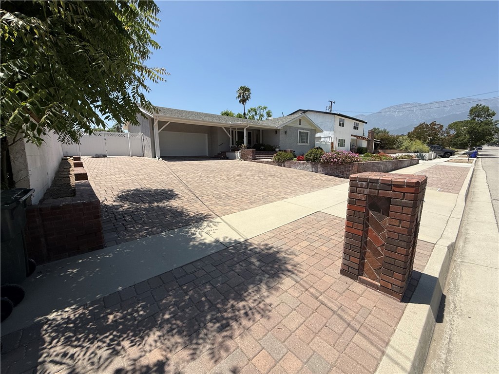 7262 Beryl Street Rancho Cucamonga, CA 91701 - Photo 3 of 30 a front view of a house with a yard