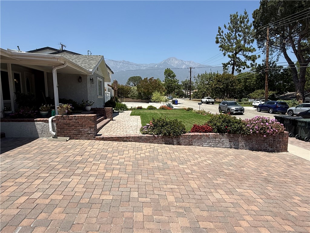 7262 Beryl Street Rancho Cucamonga, CA 91701 - Photo 9 of 30 a view of a house with garden and pathway