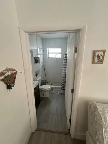 a bathroom with a sink and toilet
