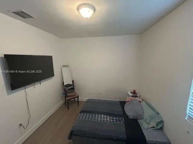 a bedroom with a bed and cabinets