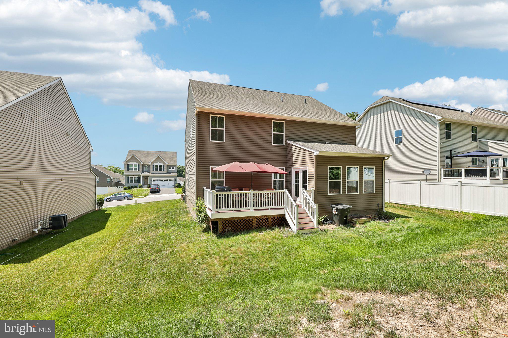 507 Potomac Road Joppa, MD 21085 - Photo 48 of 66 a front view of a house with a yard and garage