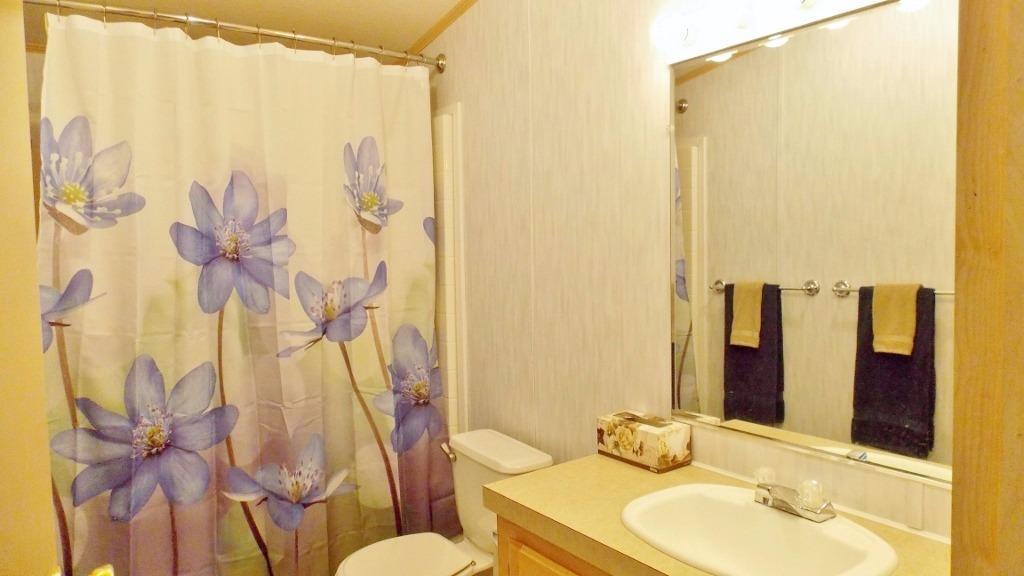 1894 South Obenchain Road Eagle Point, OR 97524 - Photo 11 of 16 a bathroom with a sink toilet and shower