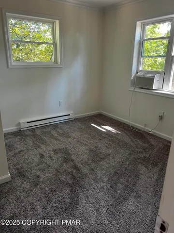 a view of a house with swimming pool and sitting area