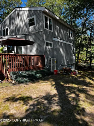a living room with furniture floor to ceiling window and a fireplace