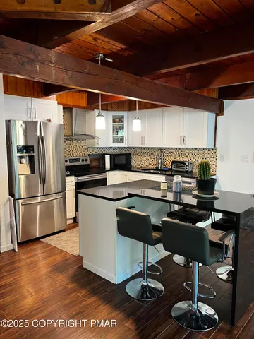 a bathroom with a shower and a sink