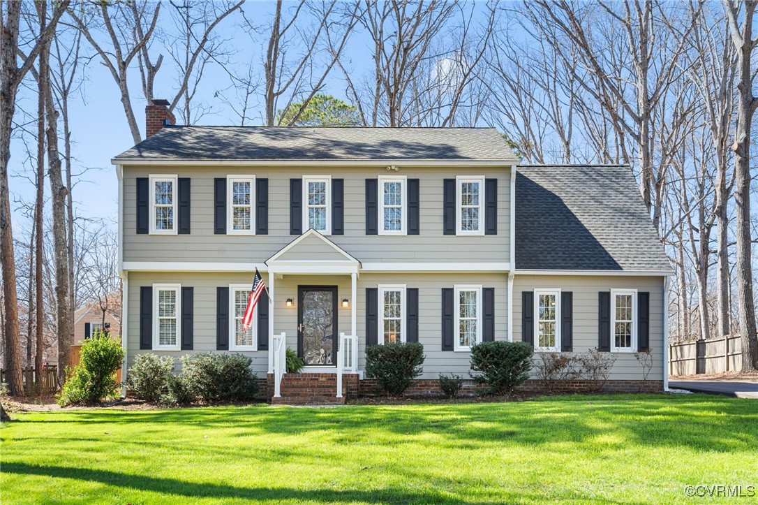 706 Watch Hill Road Midlothian, VA 23114 - Photo 1 of 42 front view of a brick house with a yard