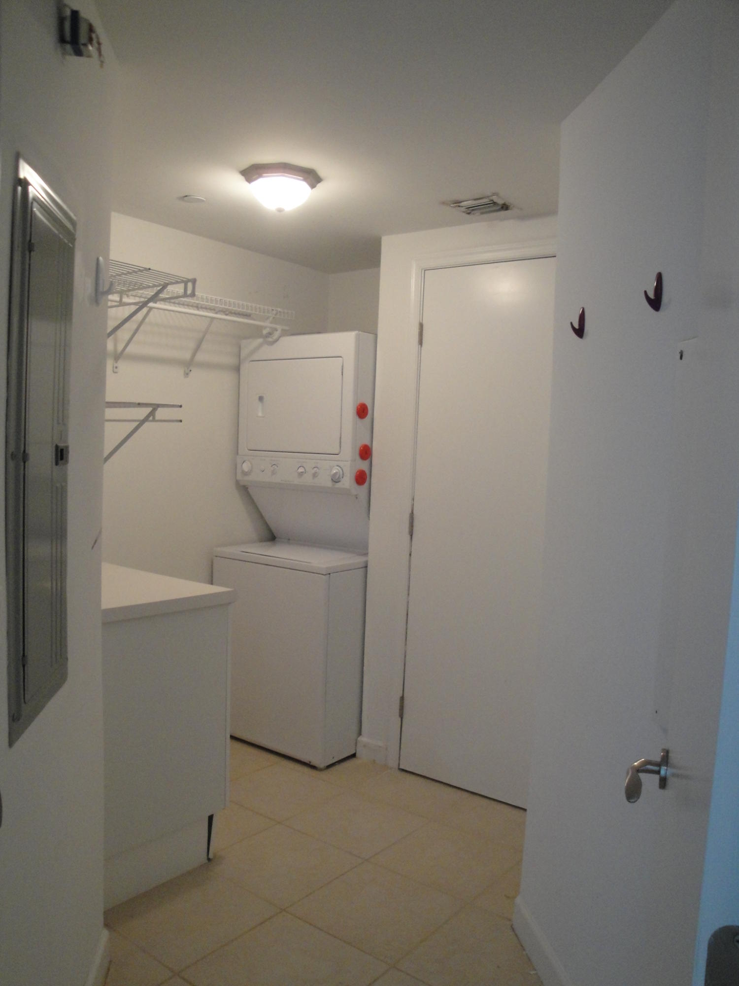 2640 Lake Shore Drive, Unit 2307 Riviera Beach, FL 33404 - Photo 75 of 77 SPACIOUS LAUNDRY RM WITH STORAGE CLOSET