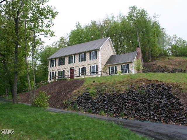 148 Walnut Tree Hill Road Newtown, CT 06482 - Photo 1 of 1 a front view of a house with a garden