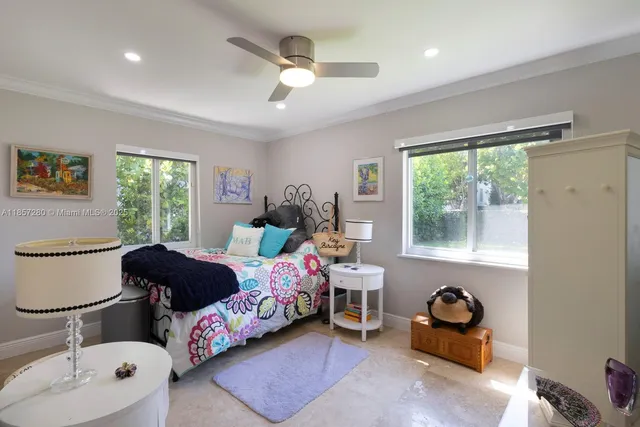a bedroom with furniture and a window