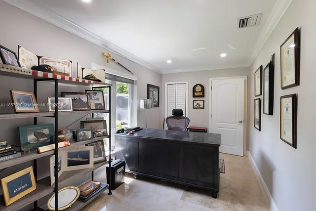 a work room with furniture and a window