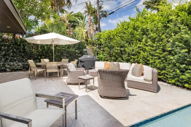 a view of a patio with furniture and a table