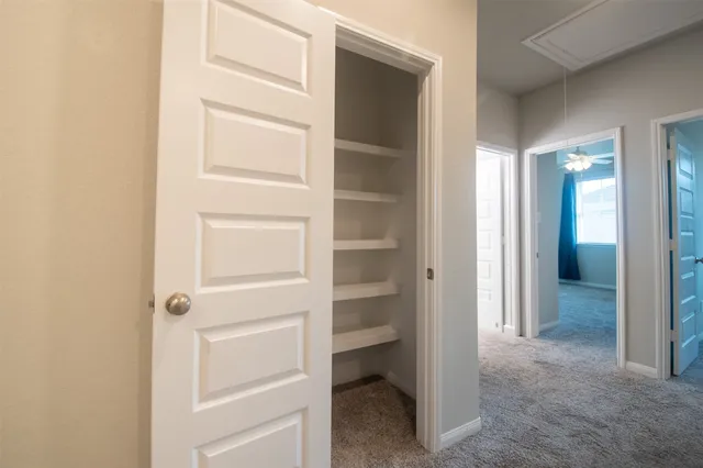 an empty room with closet area